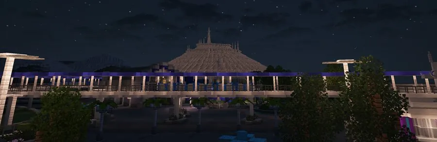 Monorail track passing in front of Space Mountain at night